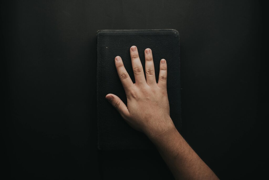 Hand on Bible